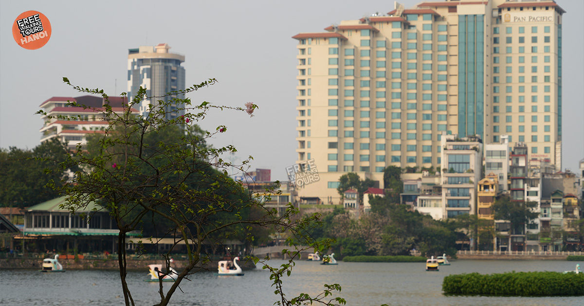 Locals enjoying a peaceful morning by West Lake, Hanoi